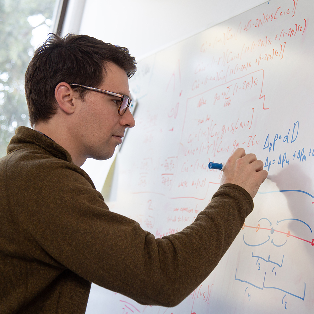 Lecturer writing on white board